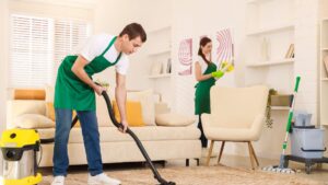 Professional cleaners vacuuming a living room, showcasing eco-friendly cleaning practices and attention to detail in a Scottsdale home.